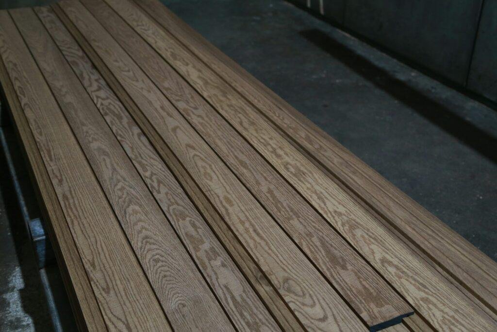 a close up of a wooden bench in a building